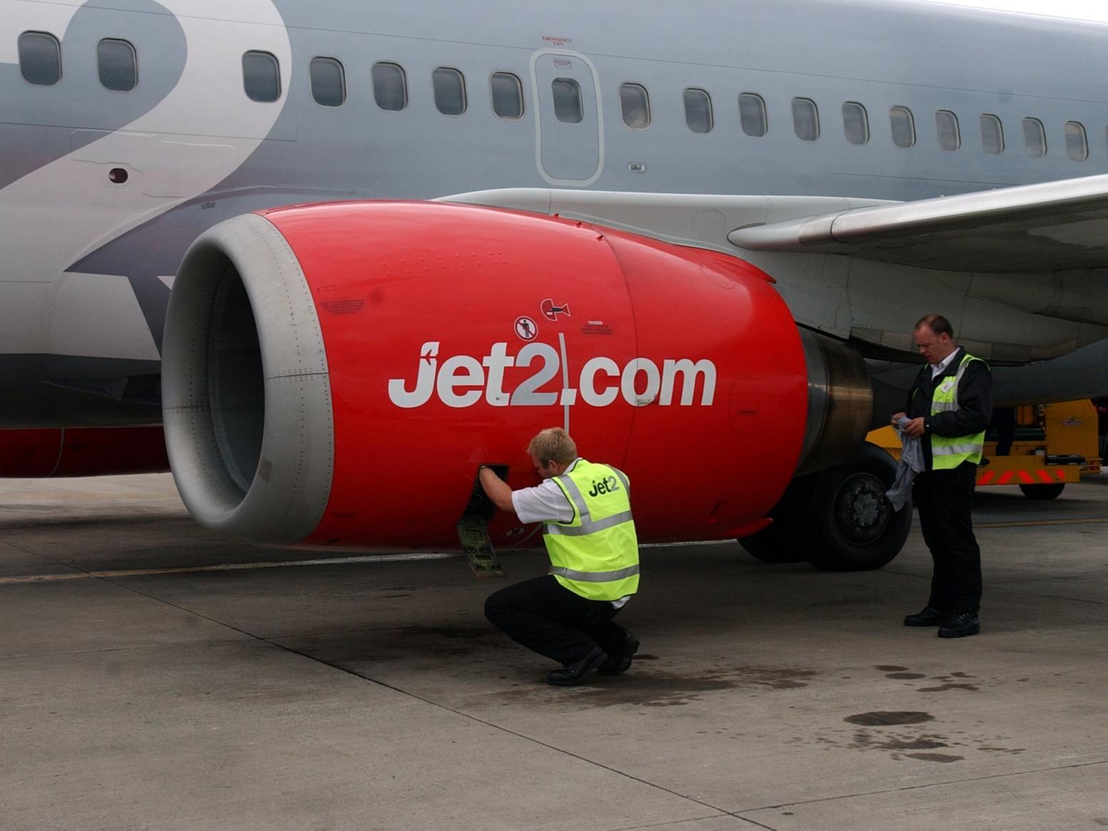 Jet2 ground crew check the plane.
