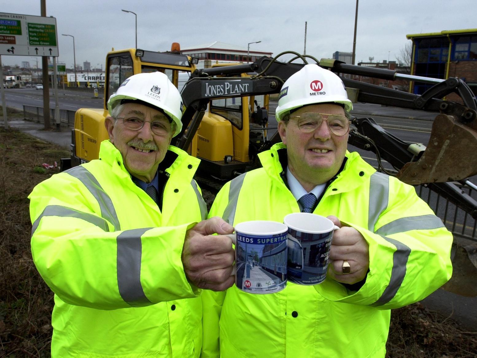 Chairman of Metro, Mick Lyons (right) and Coun Brian Walker mark the start of the first stage of the Leeds Supertram on Hunslet Road.