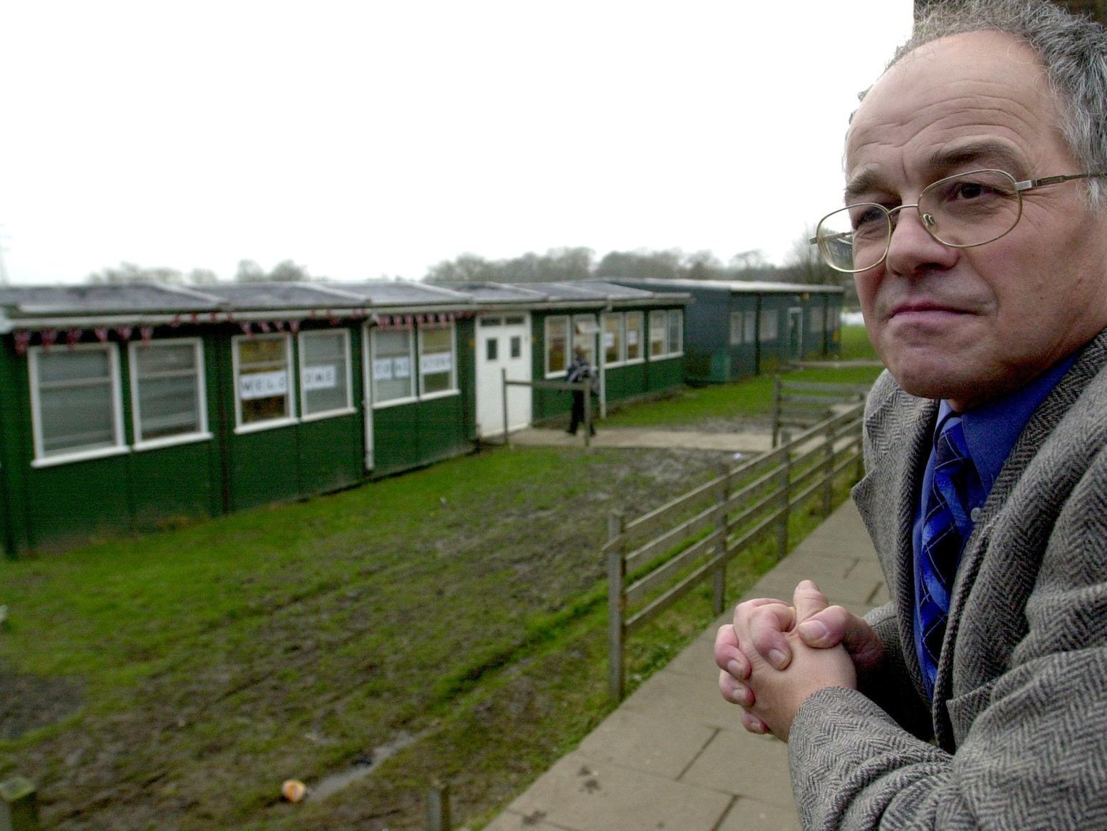 Priesthorpe School head teacher Clive Pickles looks across an area where new classrooms were going to be built,.