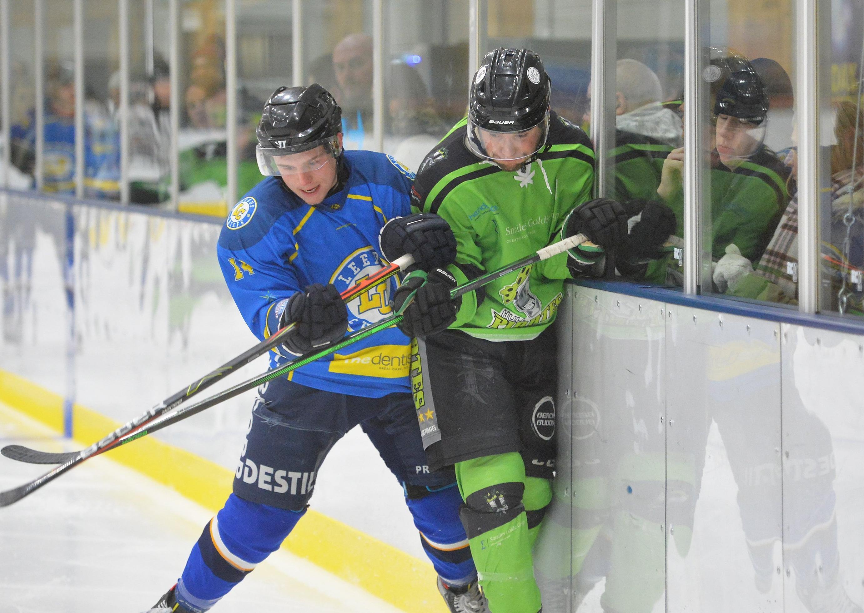 TAKE THAT: Eventual Leeds Chiefs' game-winner Lewis Baldwin gets in a hit on the boards in Friday night's derby against Hull Pirates. Picture: Dean Woolley.