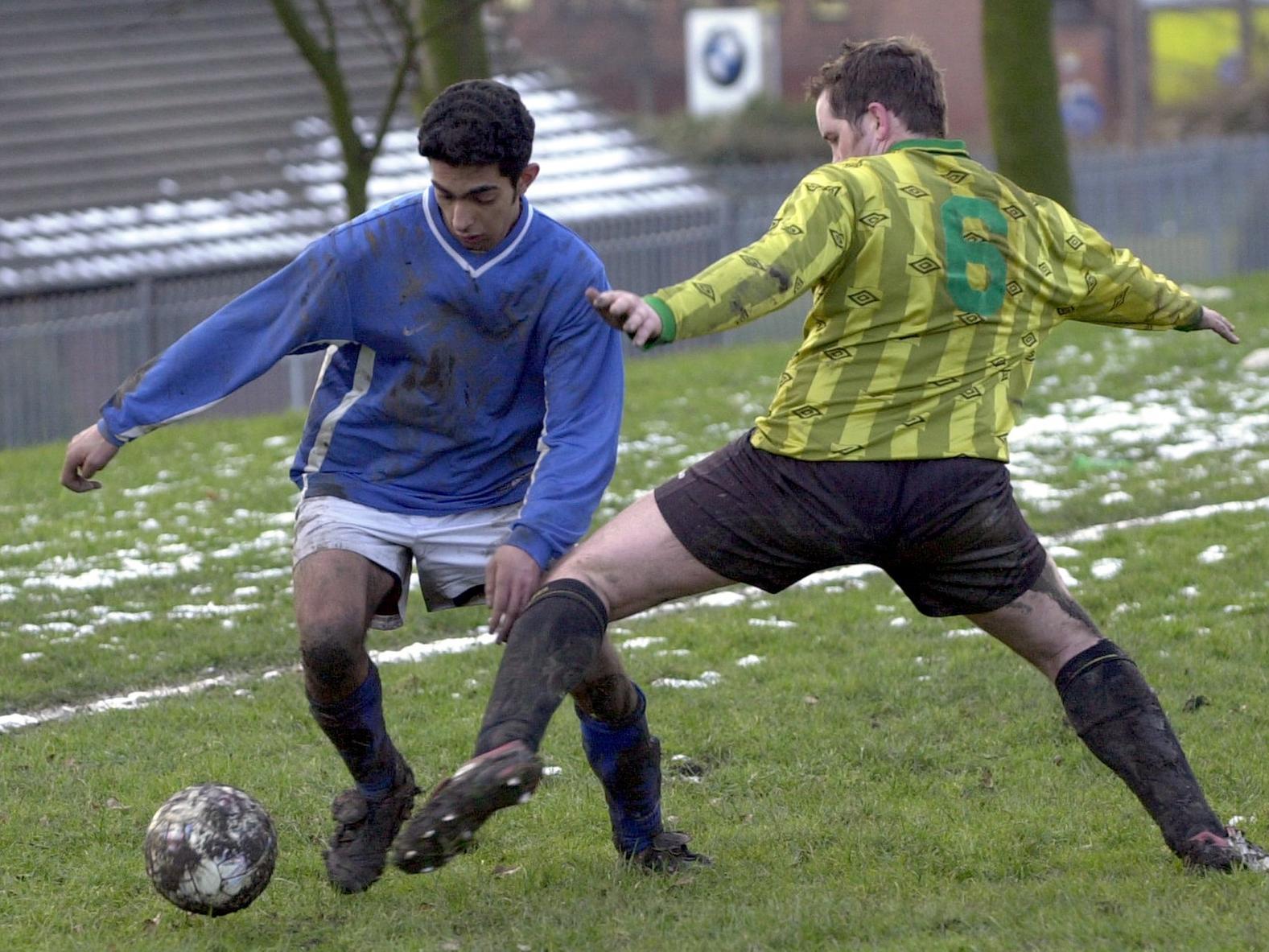 Naveed Altaf of Street Works takes on Jimmy Allan of F.C Headingley.