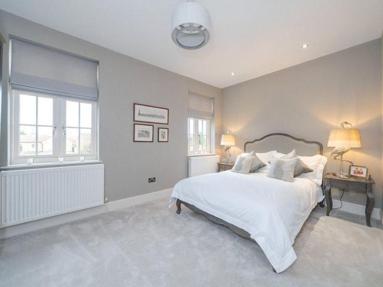 The property features six spacious double bedrooms, four of which benefit from en-suite bathrooms.