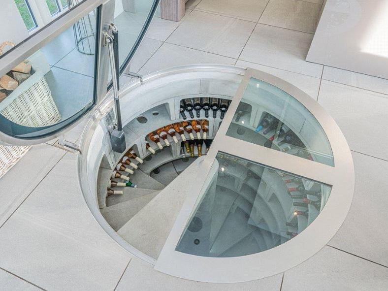 Bringing a real wow factor to the kitchen diner is this impressive spiral wine cellar, which is sunken into the floor, offering plenty of storage space without cluttering the room.