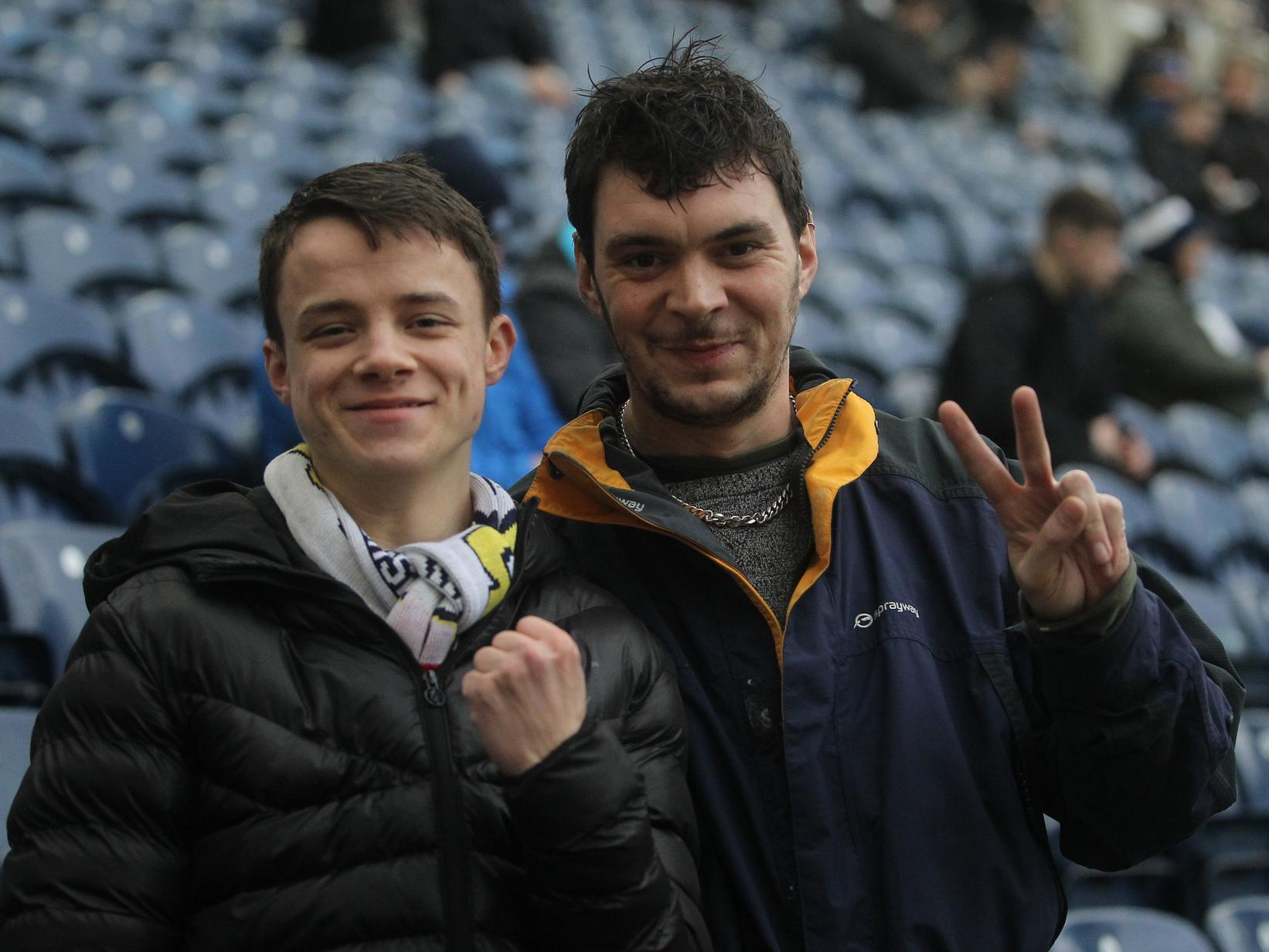 Two Preston fans give our cameraman a smile and a bit of a pose