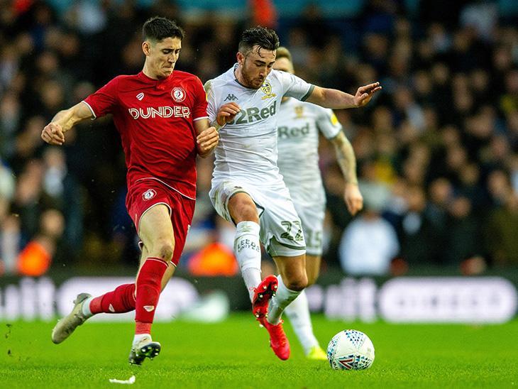 Jack Harrison battles with Callum O'Dowda as Leeds go in search of a second goal.
