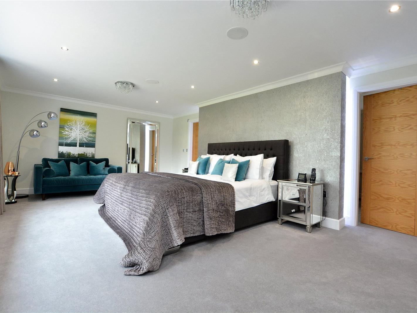 The master bedroom suite has views out over the rear garden and the countryside beyond.