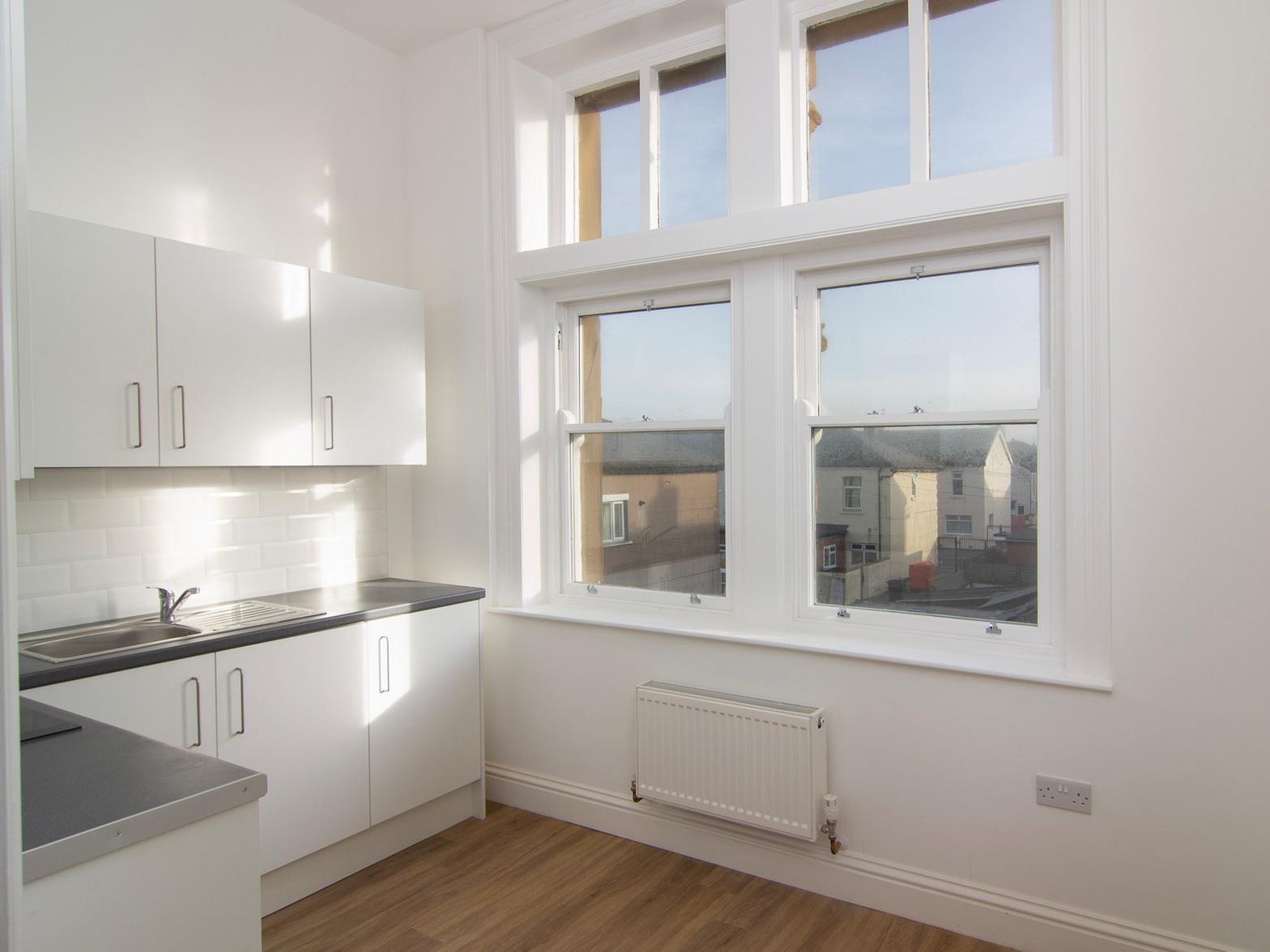The original sash windows have been kept for the new flats (CREDIT: SOMA Projects)