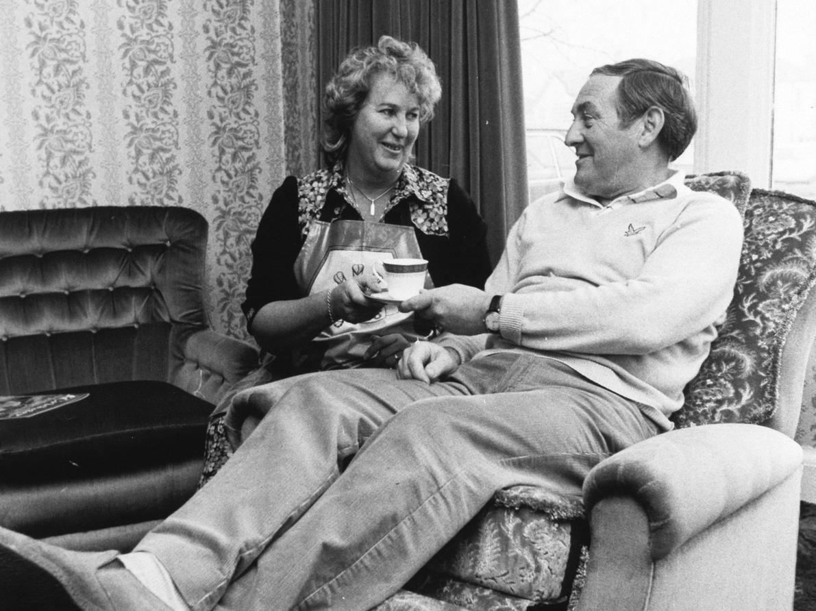 Yorkshire cricket legend Ray Illingworth eases his aching back into a special chair as his wife Shirley hands him a cup of tea.