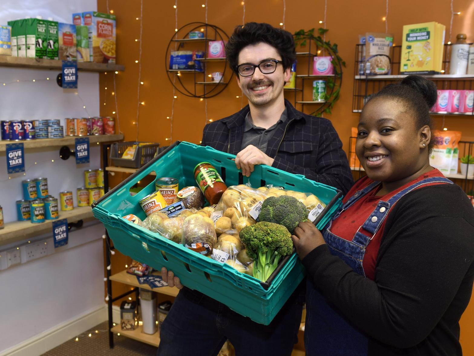 Lyndon Wallace, student group-cordinator and Eleanor Claxton, a student volunteer  with food in the student foodbank near to The Hive at Leeds Beckett University.