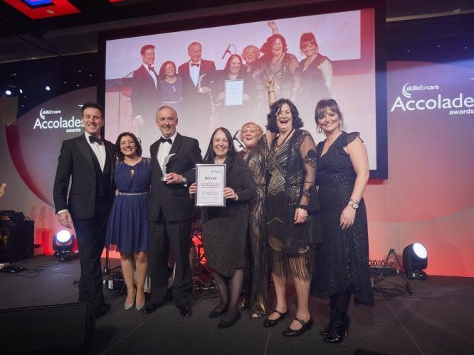 Anton Du Beke presents Leeds City Council with the award.