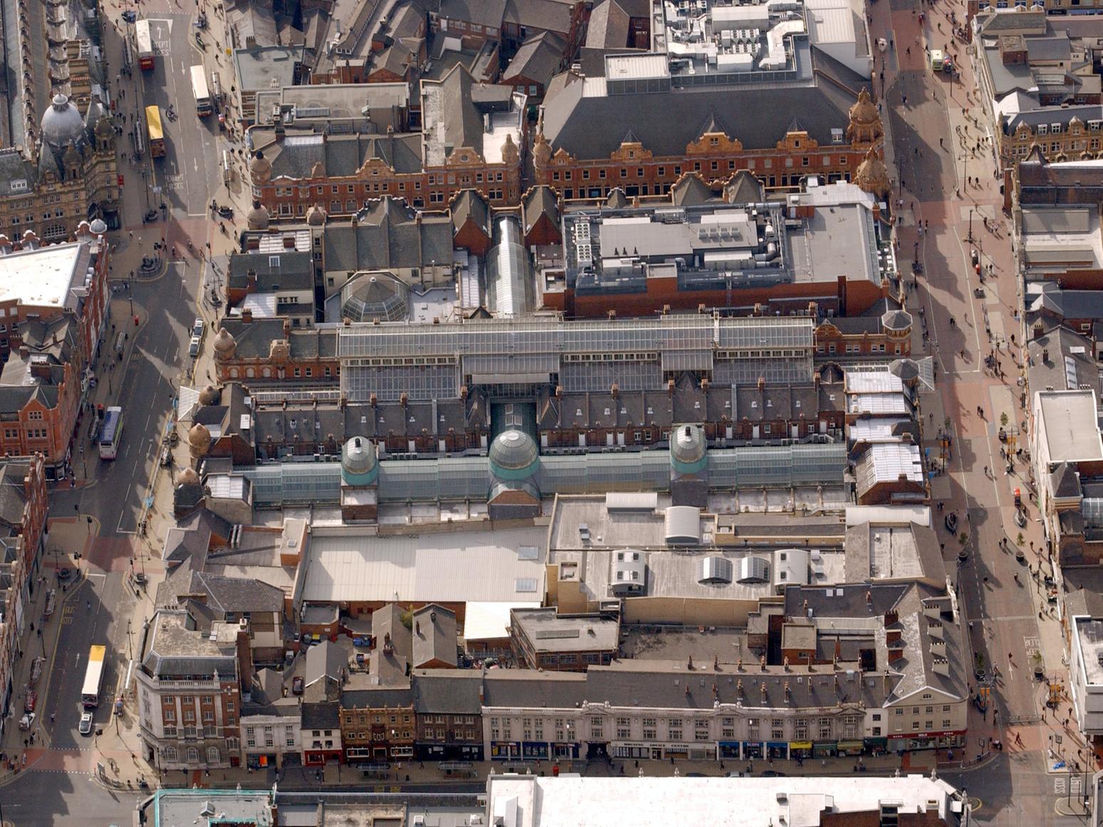 Difficult spot this one. Which landmark dominates this photo with Briggate featured? Answer -  Leeds Victoria Quarter.