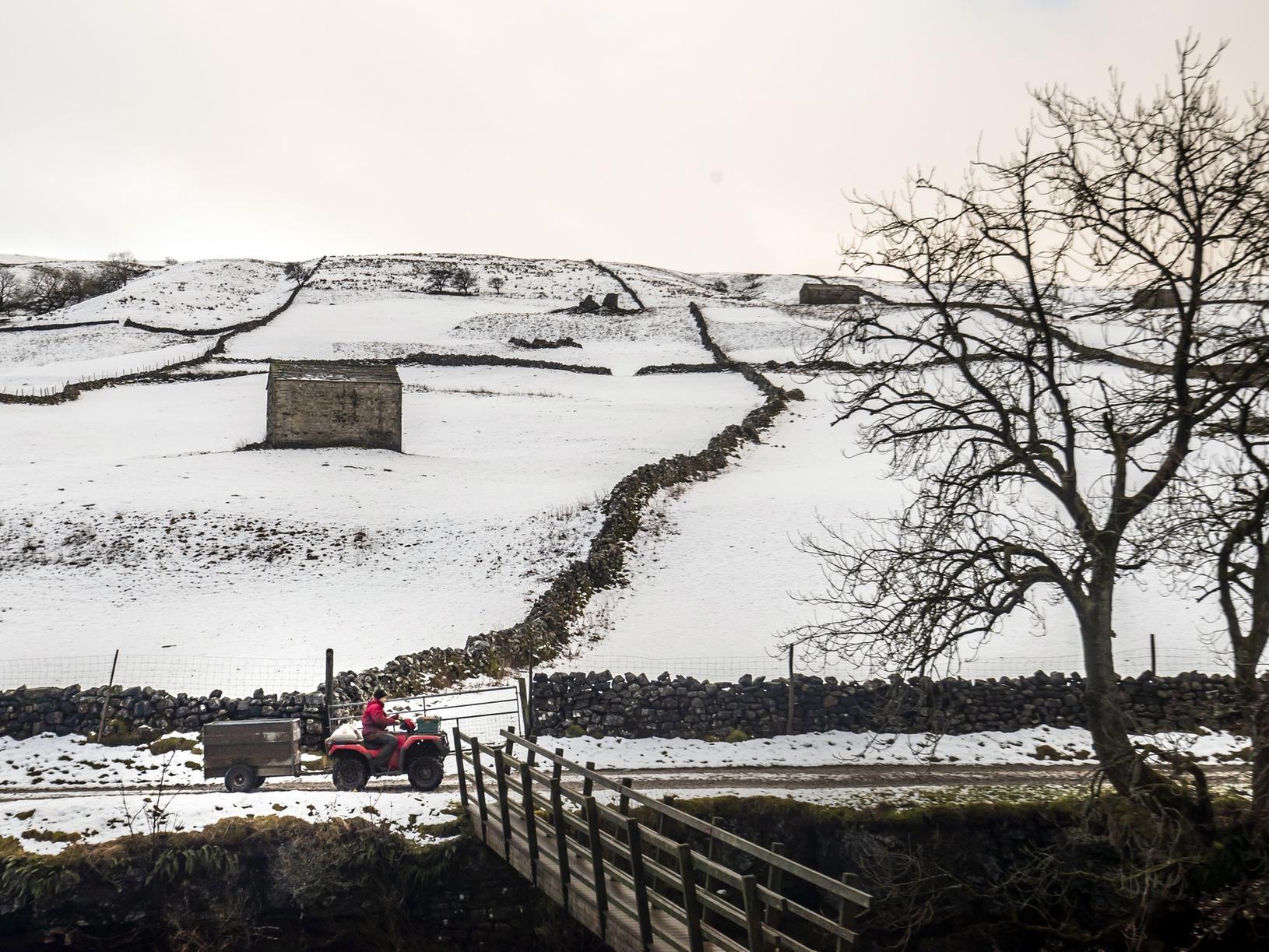 A farmer heads to work in the Dales this morning