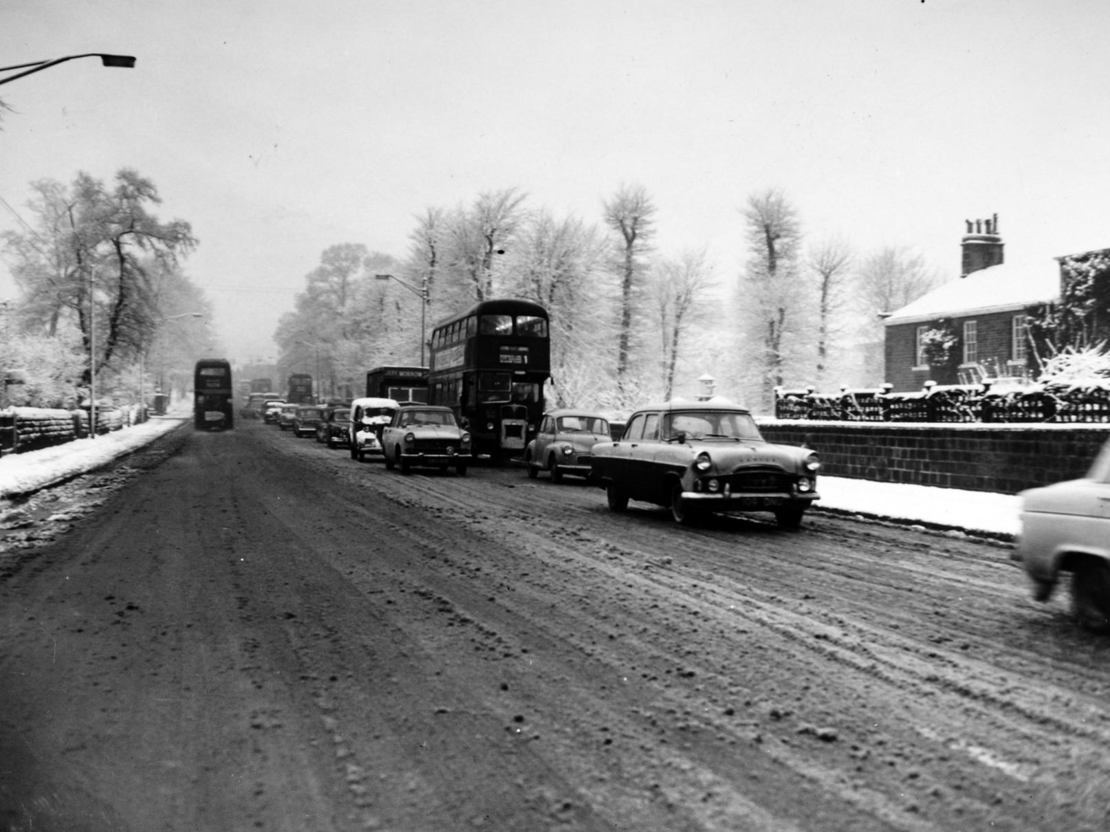 Traffic crawls along Otley Road in Headingley after heavy snow.