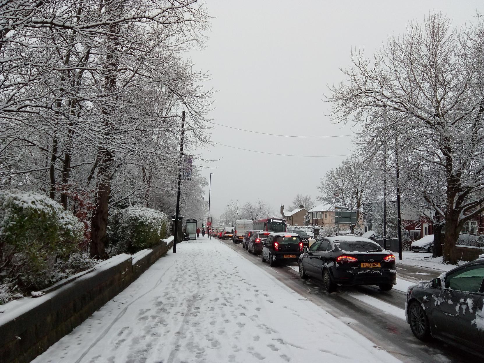 Vehicles queuing in the snow this morning along Knaresborough Road.