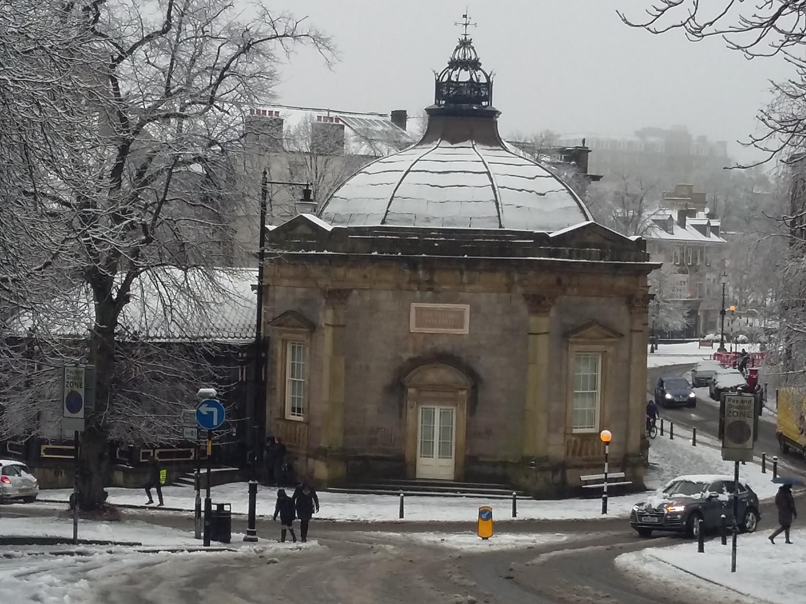 Snowy conditions around the Pump Room in the town centre.