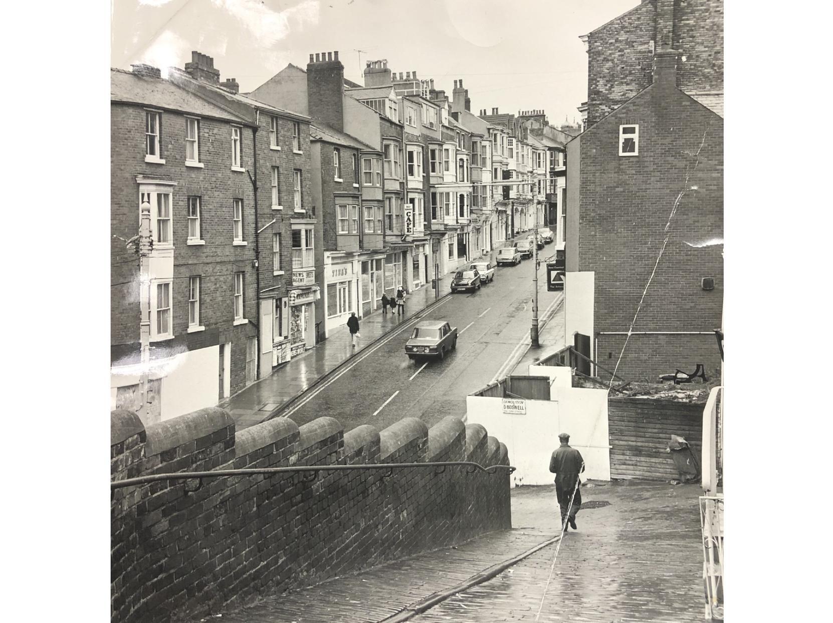 A man walks down West Sandgate towards the bottom of Eastborough. The shop on the corner has not yet become The Joke Shop - do you know which year or decade this was?