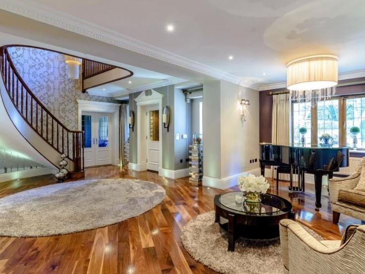 A grand reception hallway with galleried landing provides an impressive welcome to this home