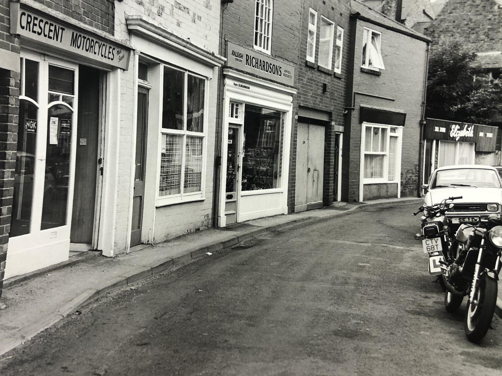 Tucked away in the little road off Ramshill there were these shops in 1982. Now largely a residential street, a motorcycle and bicycle shop used to be based there. Richardsons is still a business in the town.