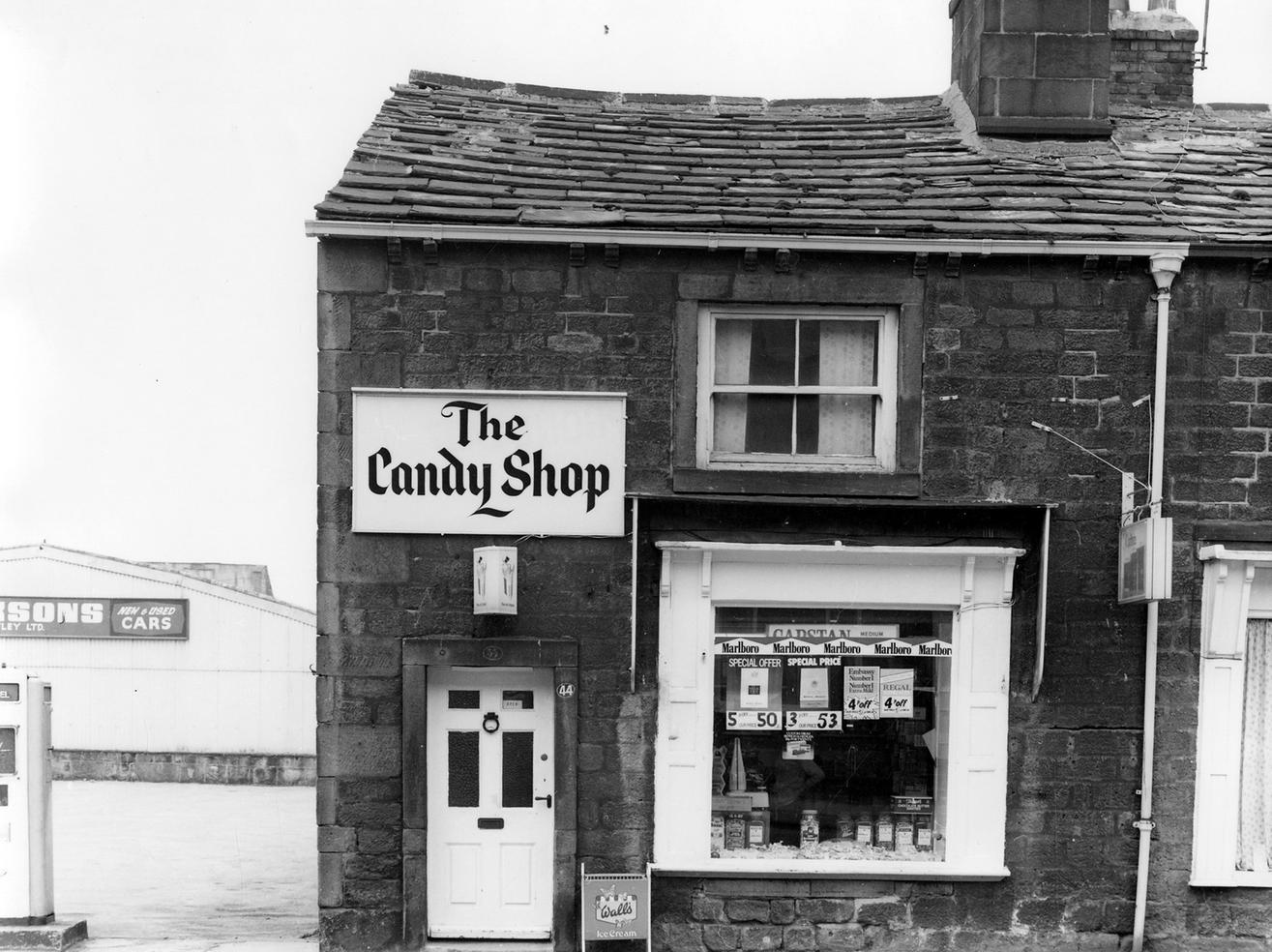 The Candy Shop, sweets and tobacco, on Boroughgate. On the left is Jackson's garage and car showroom.
