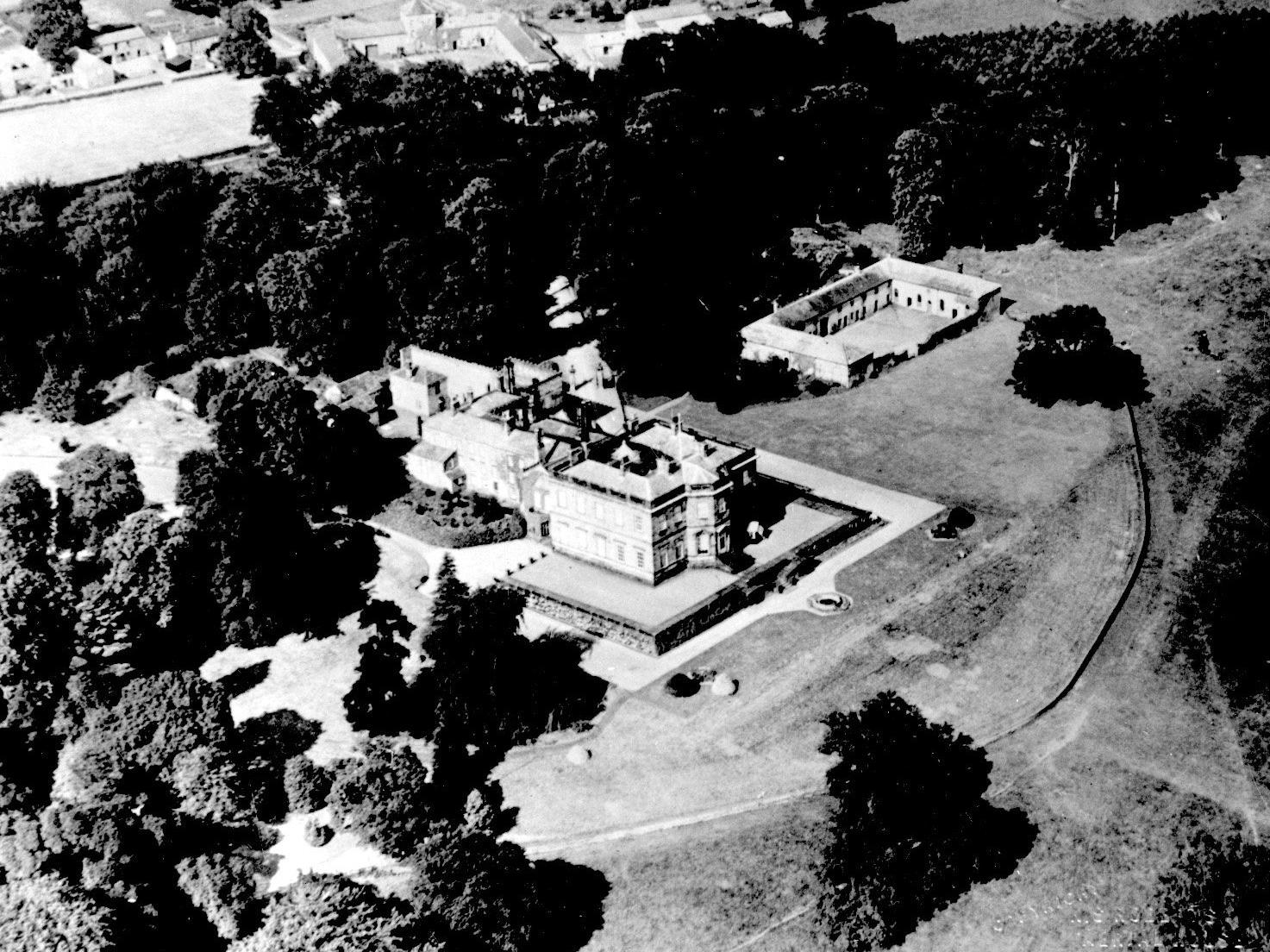 An aerial view of Farnley Hall. The older part dates from the 16th or early 17th century and much restoration and alteration has taken place since,