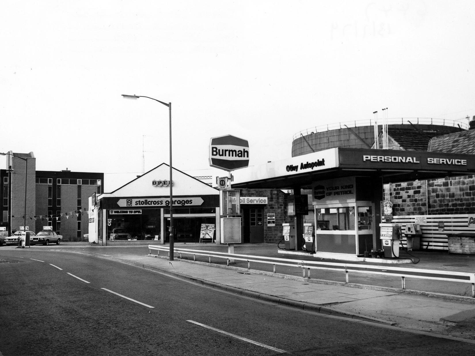 Gay Lane showing Otley Autopoint petrol station. Beside this is the junction with Wellcroft, with Stollcross Garages car showroom beyond.