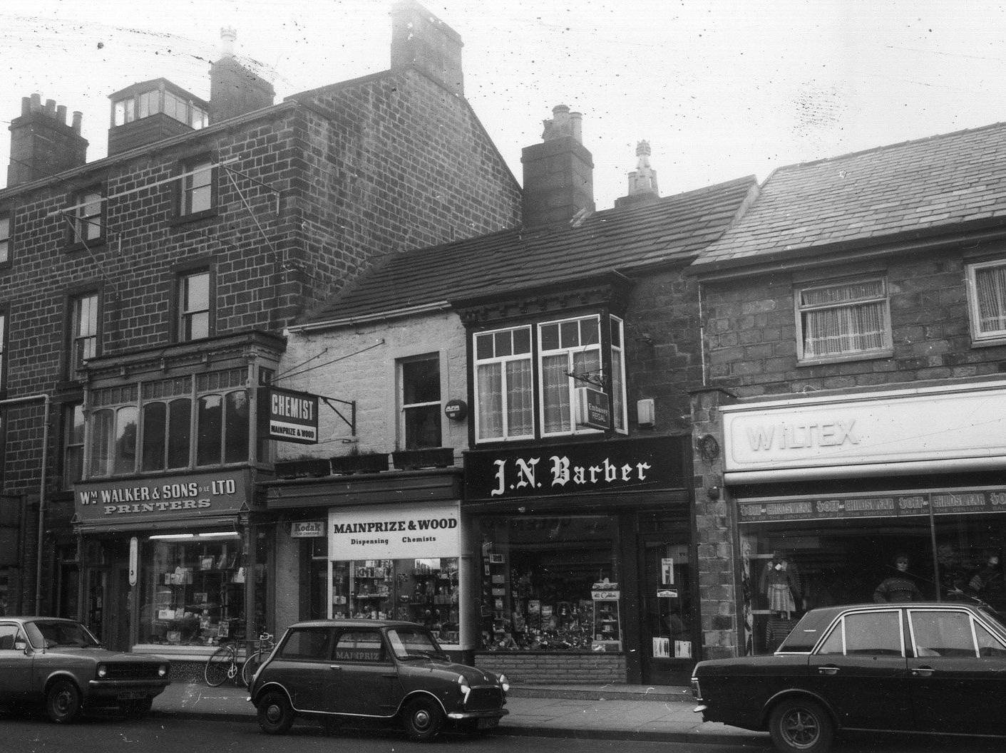 Kirkgate. Pictured, right to left, Wiltex ladies' and children's wear, J.N. Barber, tobacconist, Mainprize & Wood, dispensing chemists, followed by William Walker & Sons Ltd, printers.