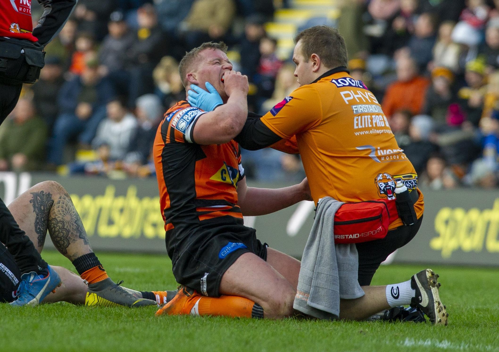 Adam Milner receives treatment against Toronto.
