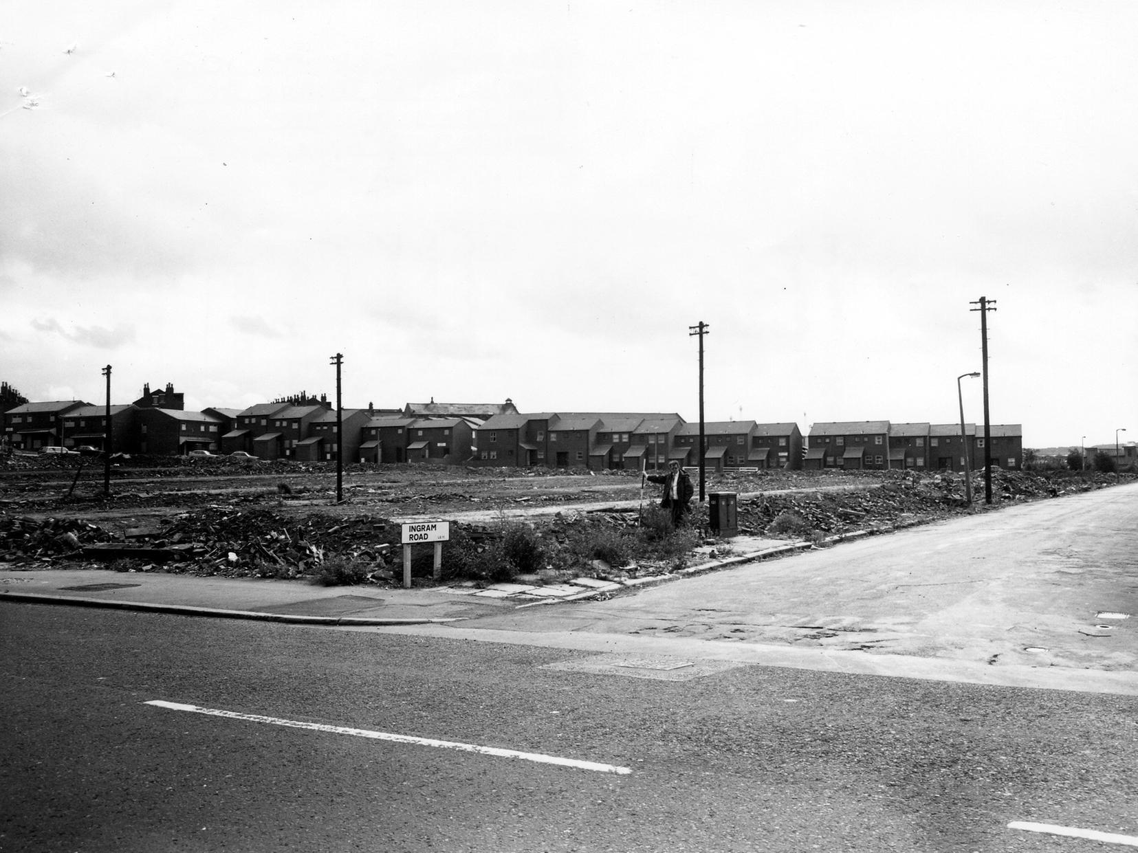 Junction of Ingram Road and Domestic Street in Holbeck showing clearance site and new council houses in the background.