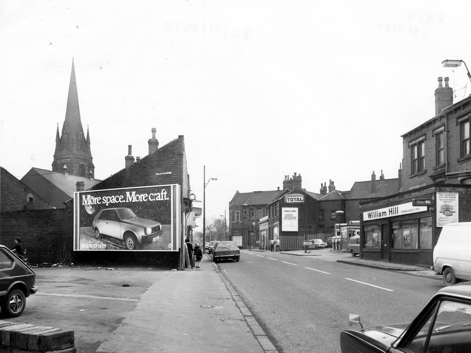 Domestic Street in Holbeck. On right is William Hill, bookmakers, next is a petrol station. Advertising hoardings can be seen, including for Renault cars and the Leeds & Holbeck Building Society, which is further along the road.