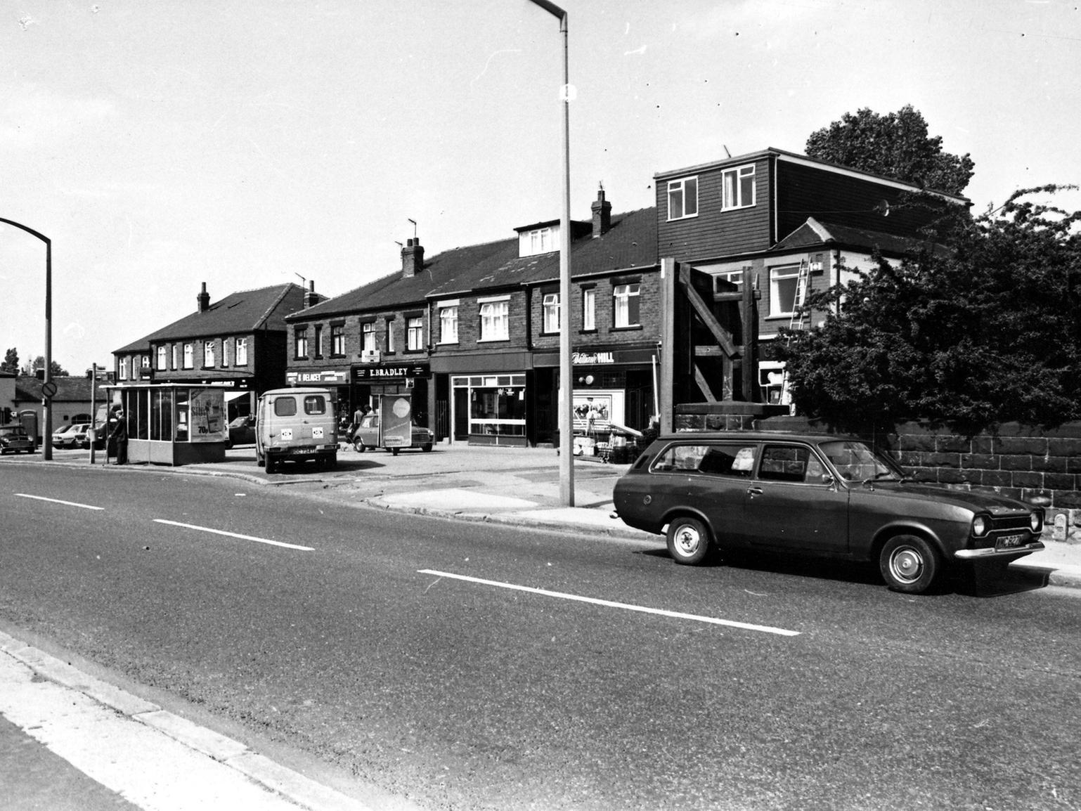 Allenby Parade, a row of shops on Ring Road Beeston Park. Businesses include R. Delacey, Jeweller, E. Bradley, and William Hill, bookmakers. On the far left of the picture is the Tommy Wass pub.