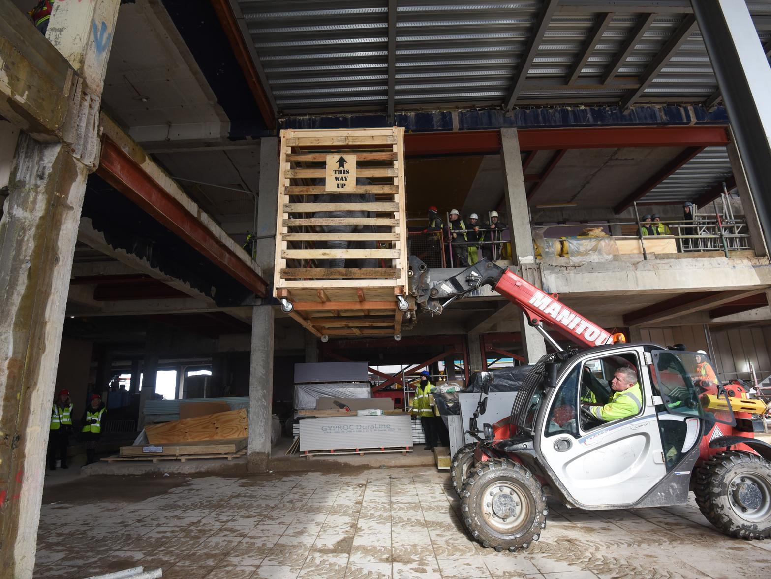 A forklift truck was used to haul the crate up to the first floor of the Sands resort hotel being built on Central Promenade