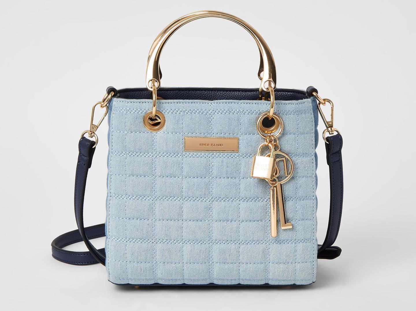 Denim goes super-dressy with this cute quilted small-sizebag with both carry and cross-body handles - and added metallic gold bling accessories. A cool touch for a new nautical look. Blue denim quilted cross body tote bag, 36, River Island.