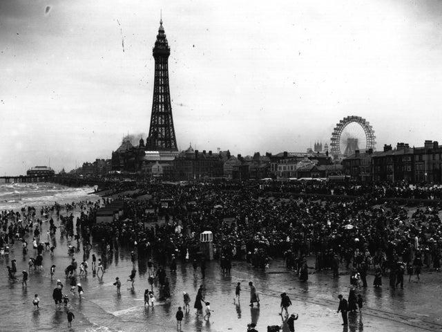 The crowds at Blackpool beach, with the tower in the background in 1920.