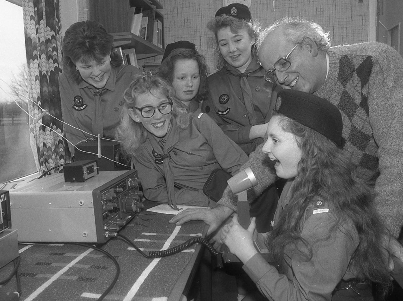 The airwaves were buzzing when guides from the First Bretherton Girl Guides enrolled the help of radio ham Frank Harrison of Leyland on "Thinking Day". Calling all Guides - Victoria Shone on the short wave radio with Nicola Corry, Sarah Clarke, Karen Flaxman, Cerise Washington and Frank Harrison
