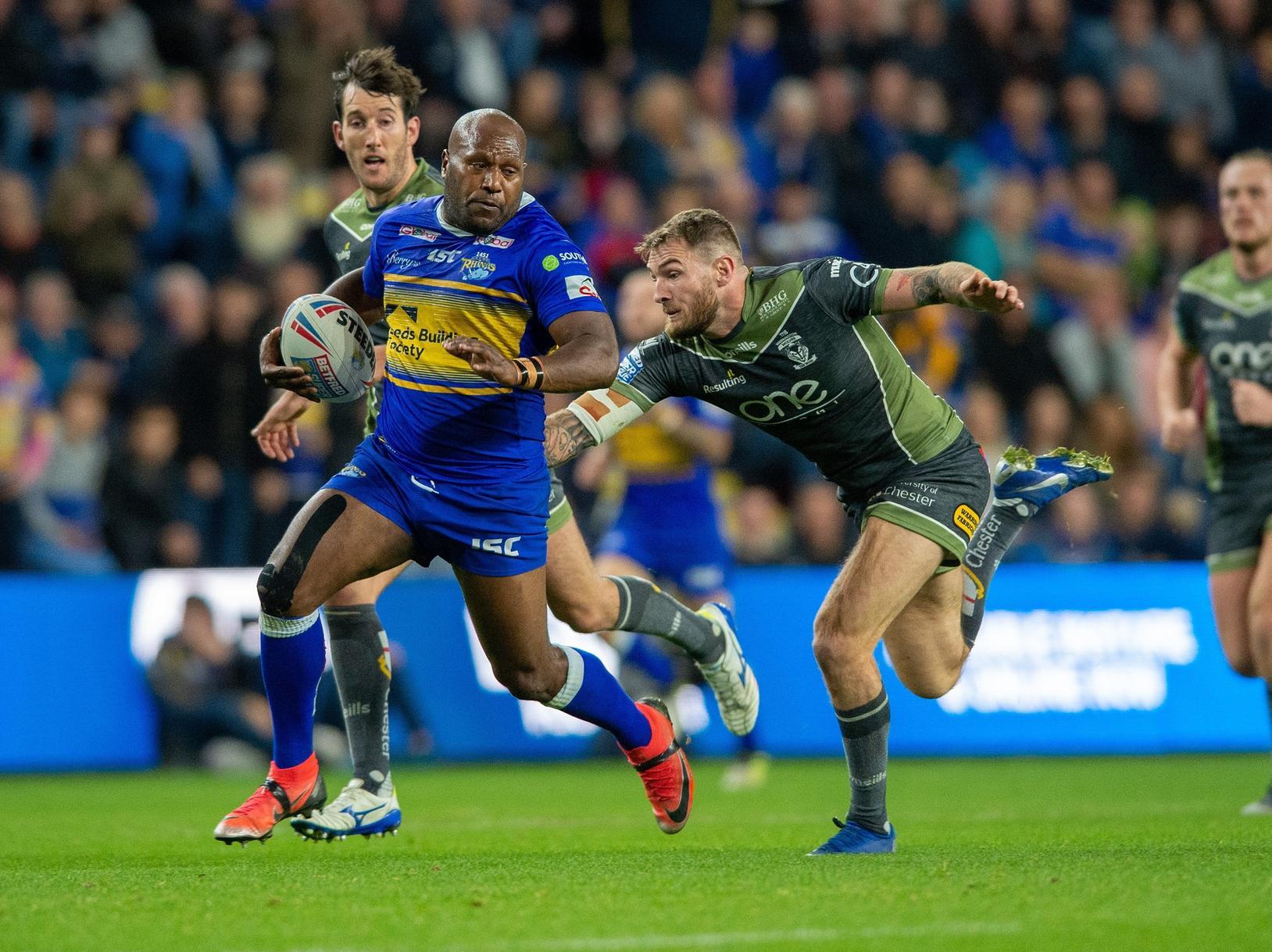 Rob Lui bursts past Daryl Clark in Leeds' win over Warrington at Headingley last year. Picture by Bruce Rollinson.