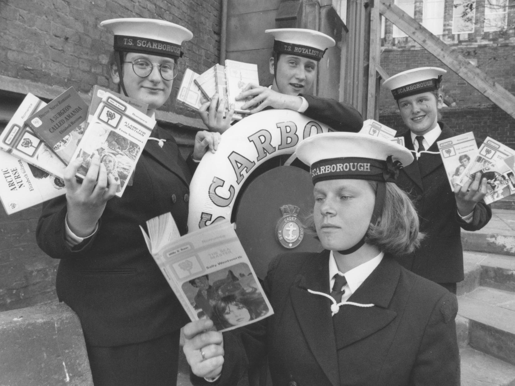 Pictured getting ready for their book sale are TS Unseen Sea Cadets, from left, Megan Peters, Zoe Roberts, Natalie Cooper, and Susan Simpson, front. Photo taken in July 1994.