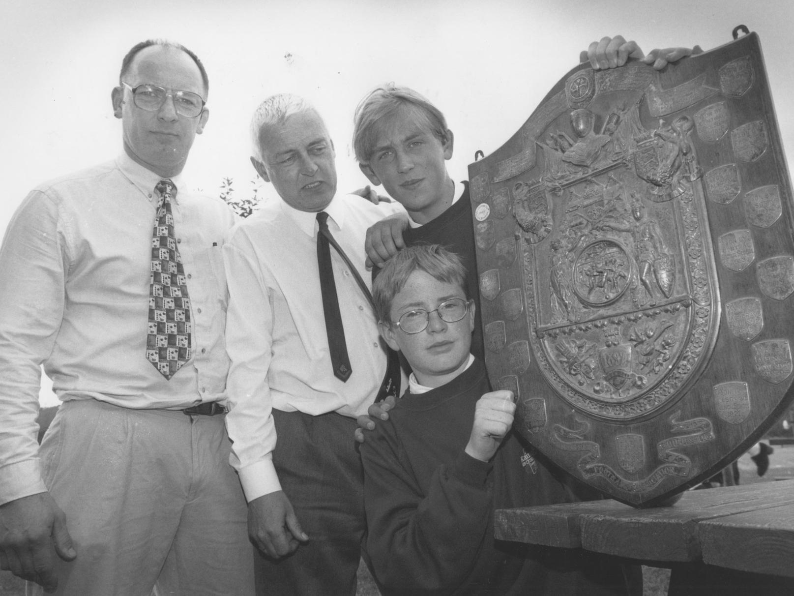 Raincliffe School Year 10 technology pupils Alex Boak, front, and Adam Hill helped restore the long lost Scarborough and District Schools Football Association Challenge Shield, dating back 100 years. They are joined by teachers Bob Chisholm and Steve Powell. Photo taken in July 1997.