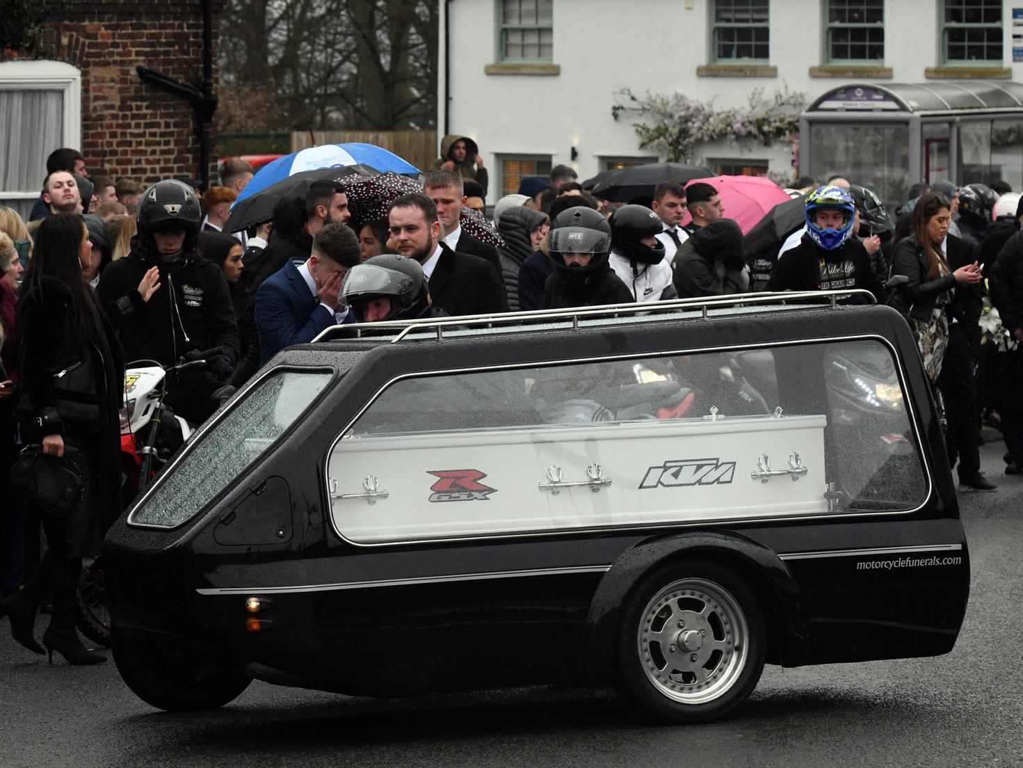 Luke's coffin in a motorcycle hearse.