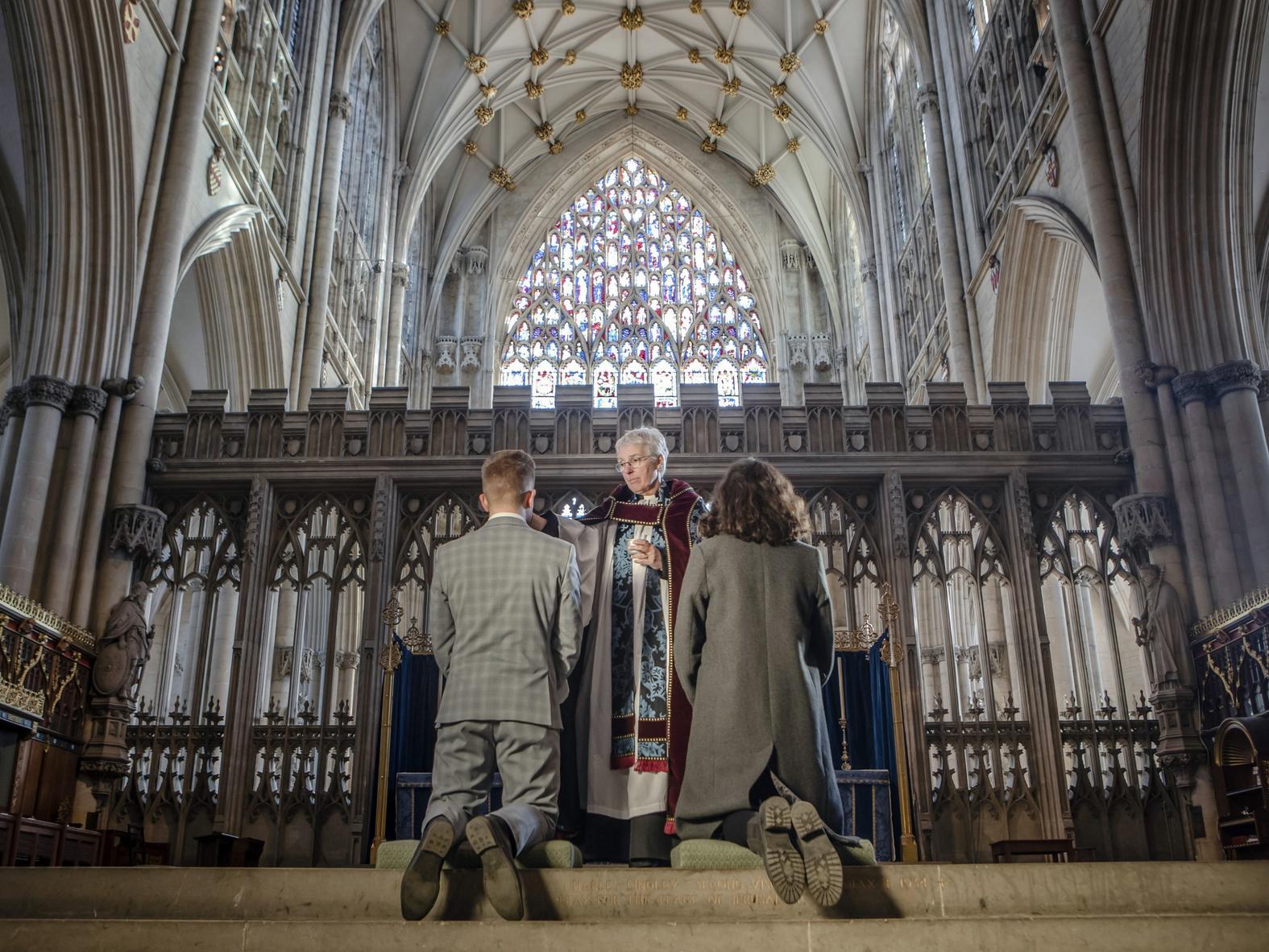 York Minster staff receive the sign of the cross in ashes on their forehead from The Revd Maggie McLean during the Imposition of Ashes on Ash Wednesday