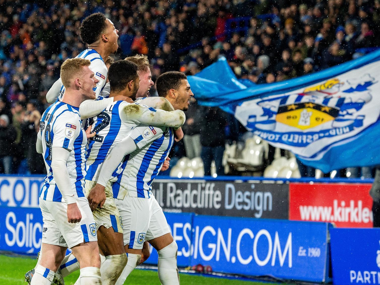 Huddersfield Town celebrate a goal in their 2-1 win against Bristol City at the John Smith's Stadium on Tuesday