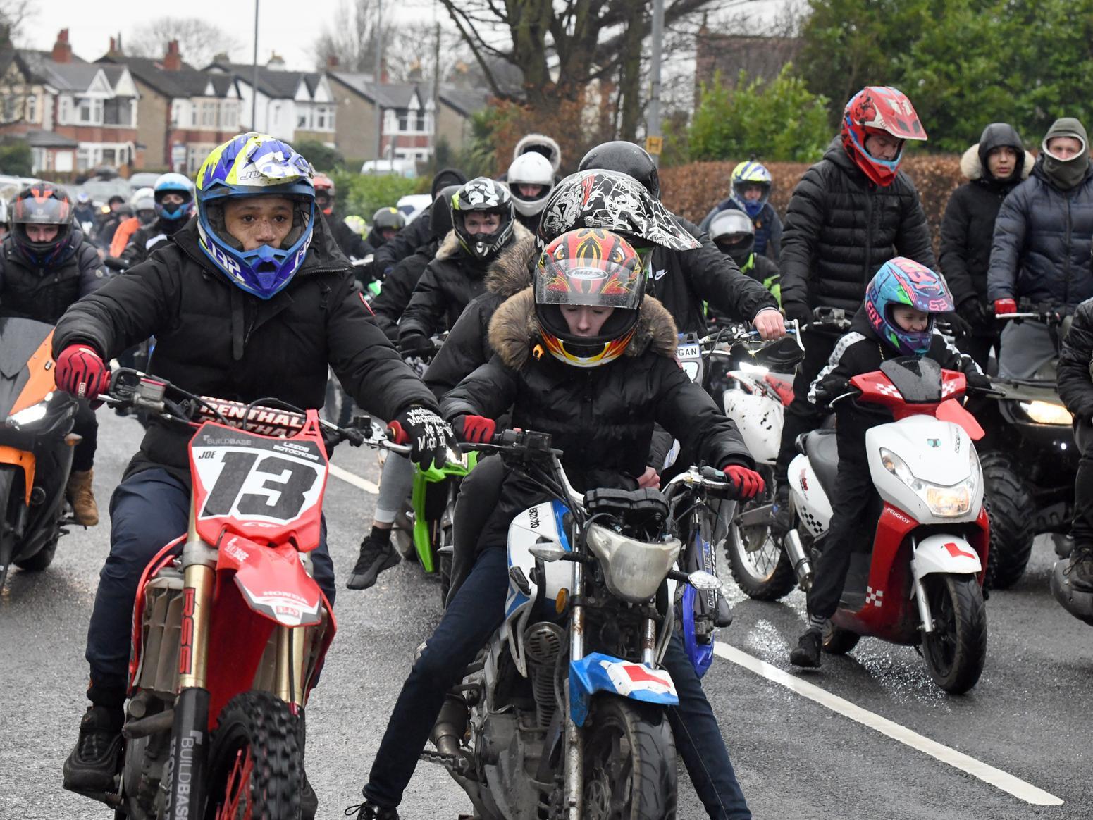 The funeral procession was filled with motorbikes.