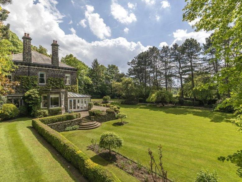 Beautiful landscaped gardens surround the property, with sweeping lawns, mature hedges and planting, while there are also a number of useful outbuildings and a greenhouse.