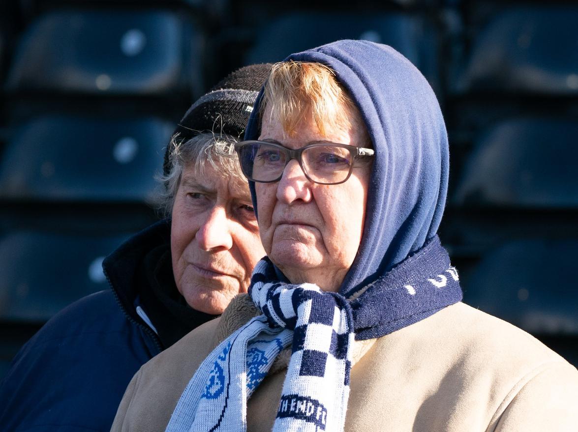 A hood and scarf combination is keeping one PNE fan warm in the stands at Craven Cottage.
