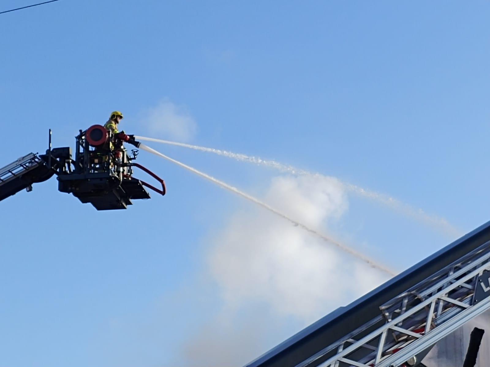 The aerial ladder platform tackles the blaze from above