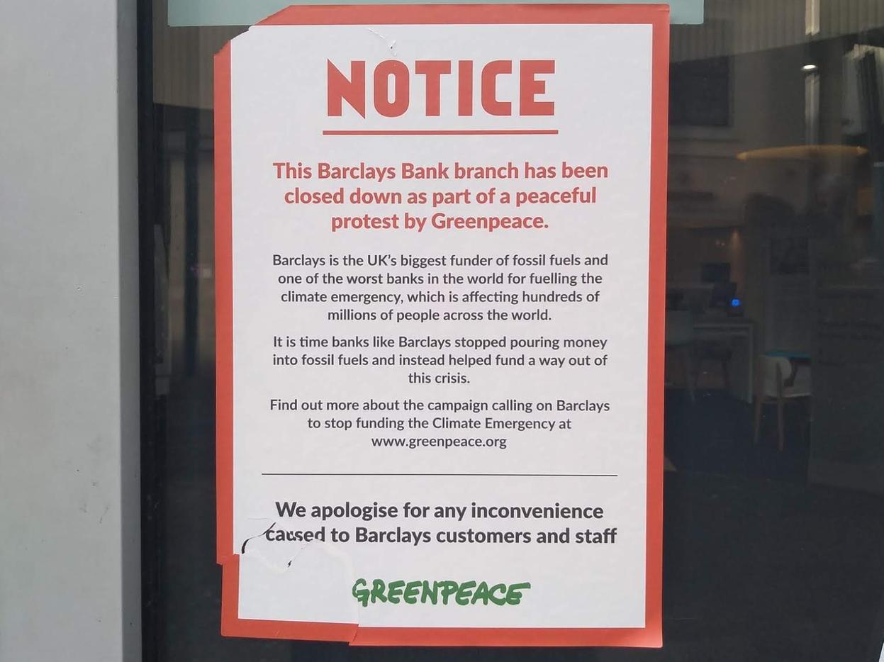 A notice posted on the Barclays door by Greenpeace activists (Photo: Kit Taylor)