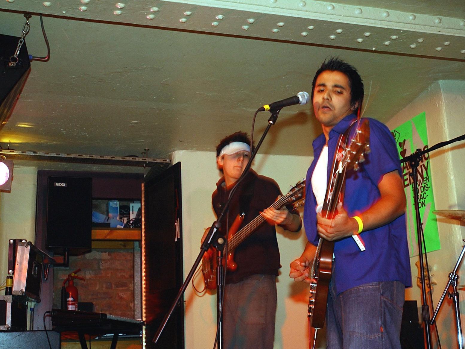 Haroon Rashid (right) from Pudsey, the lead singer of Fineapple, on stage in 2004.