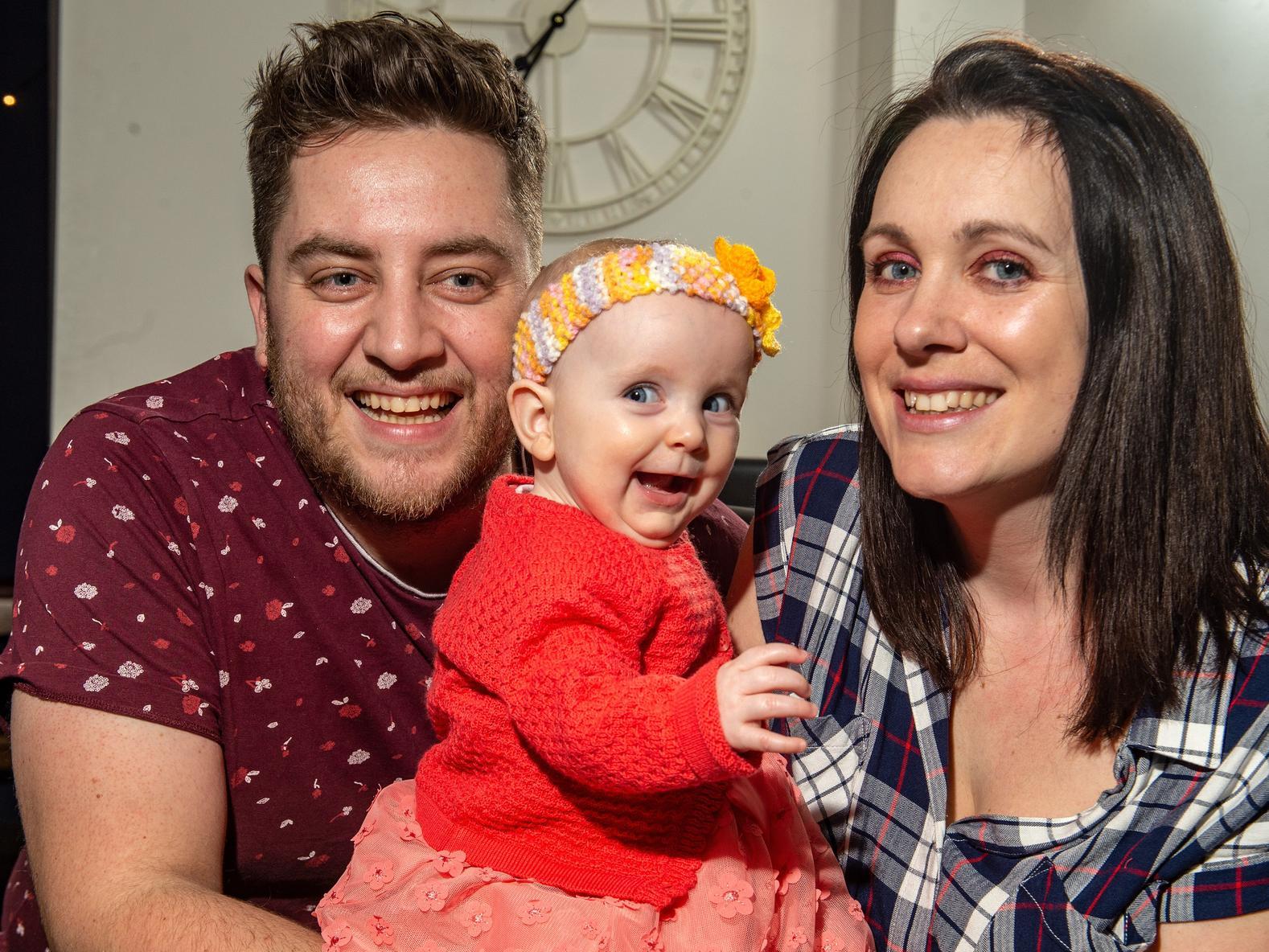 Minnie McHale, seven months, with her dad Alex McHale, 33, and mum Tara Farrar, 32. Picture: Bruce Rollinson