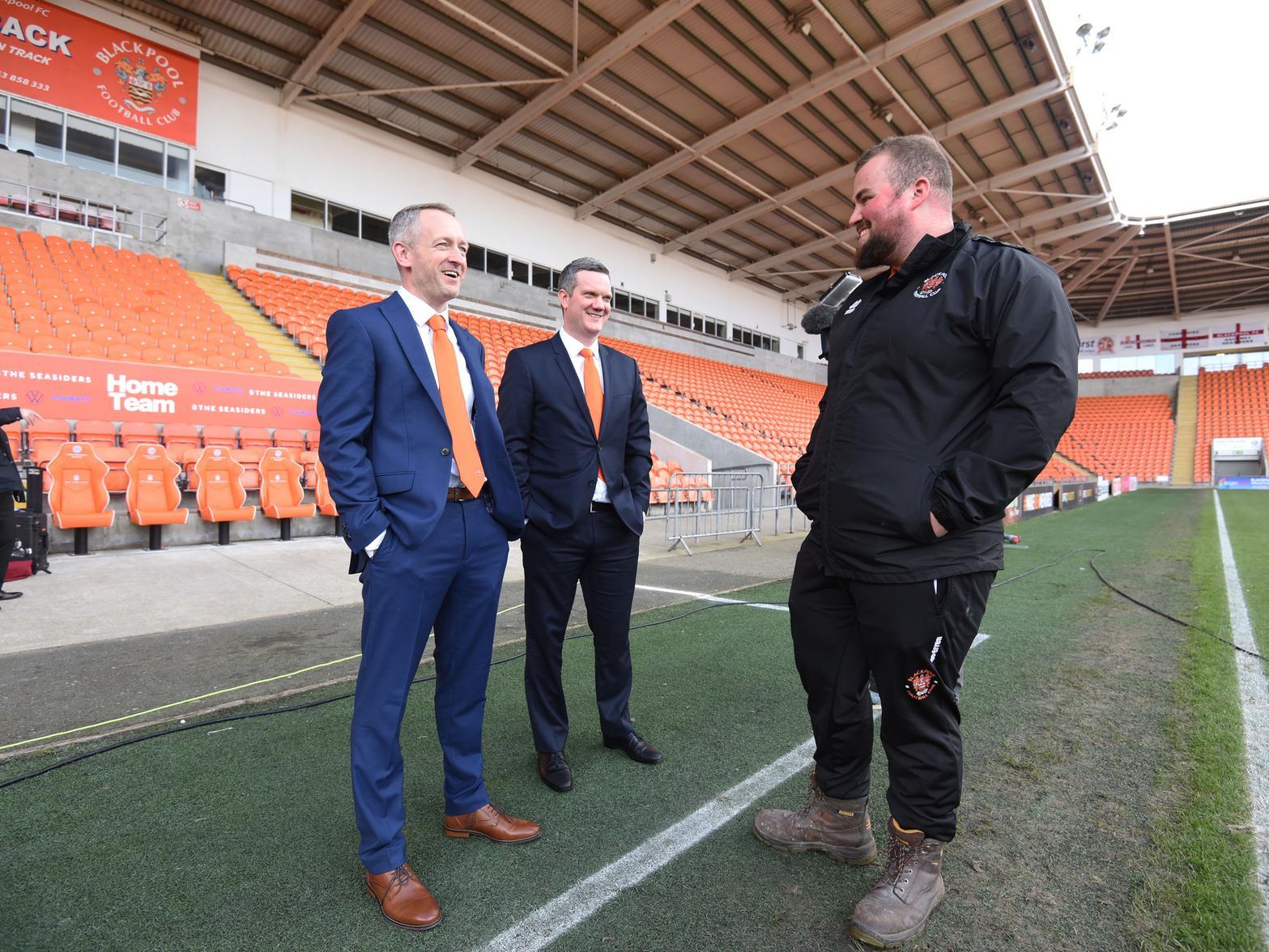 Neil Critchley chatting with chief executive Ben Mansford and groundsman Harry Bradley