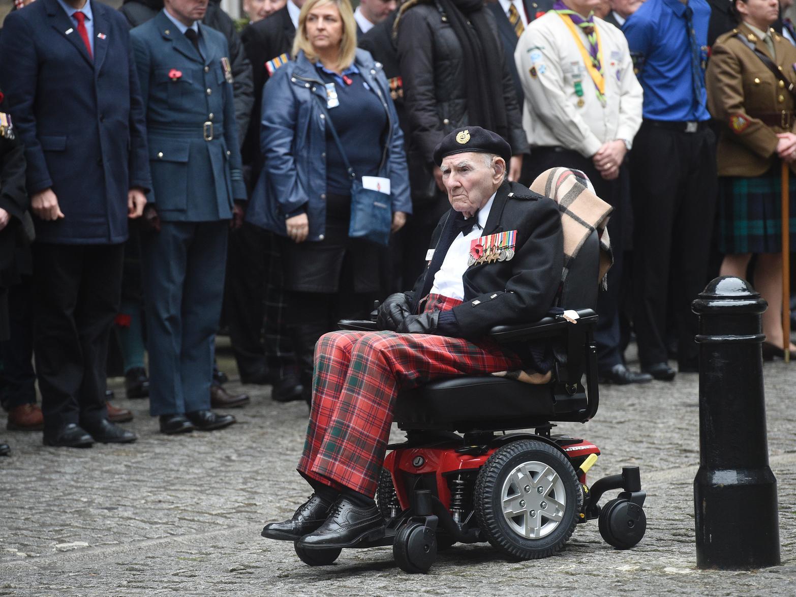 Tom taking part in the Remembrance Day parade and wreath laying at City Chambers quadrangle in 2016
