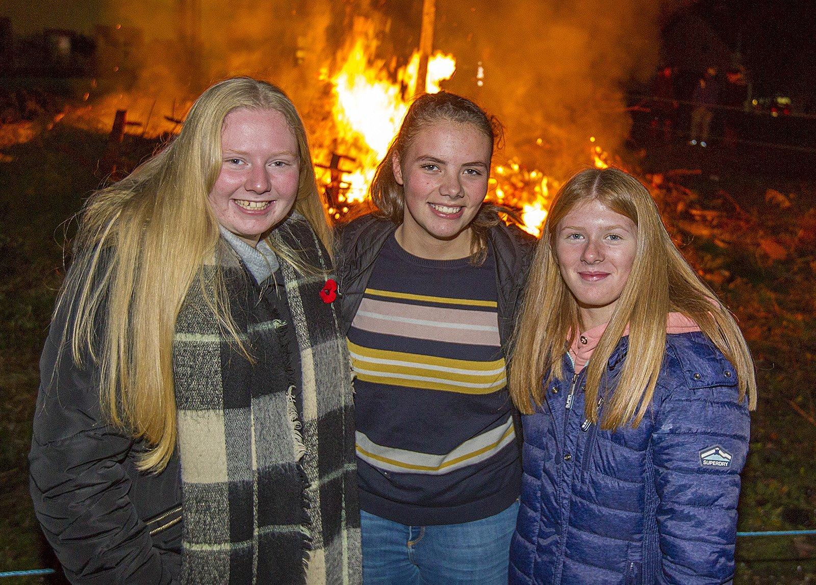 Tegan Cox, Morgan Stewart and Brodie Irvine from Jedburgh enjoy Ancrum bonfire.